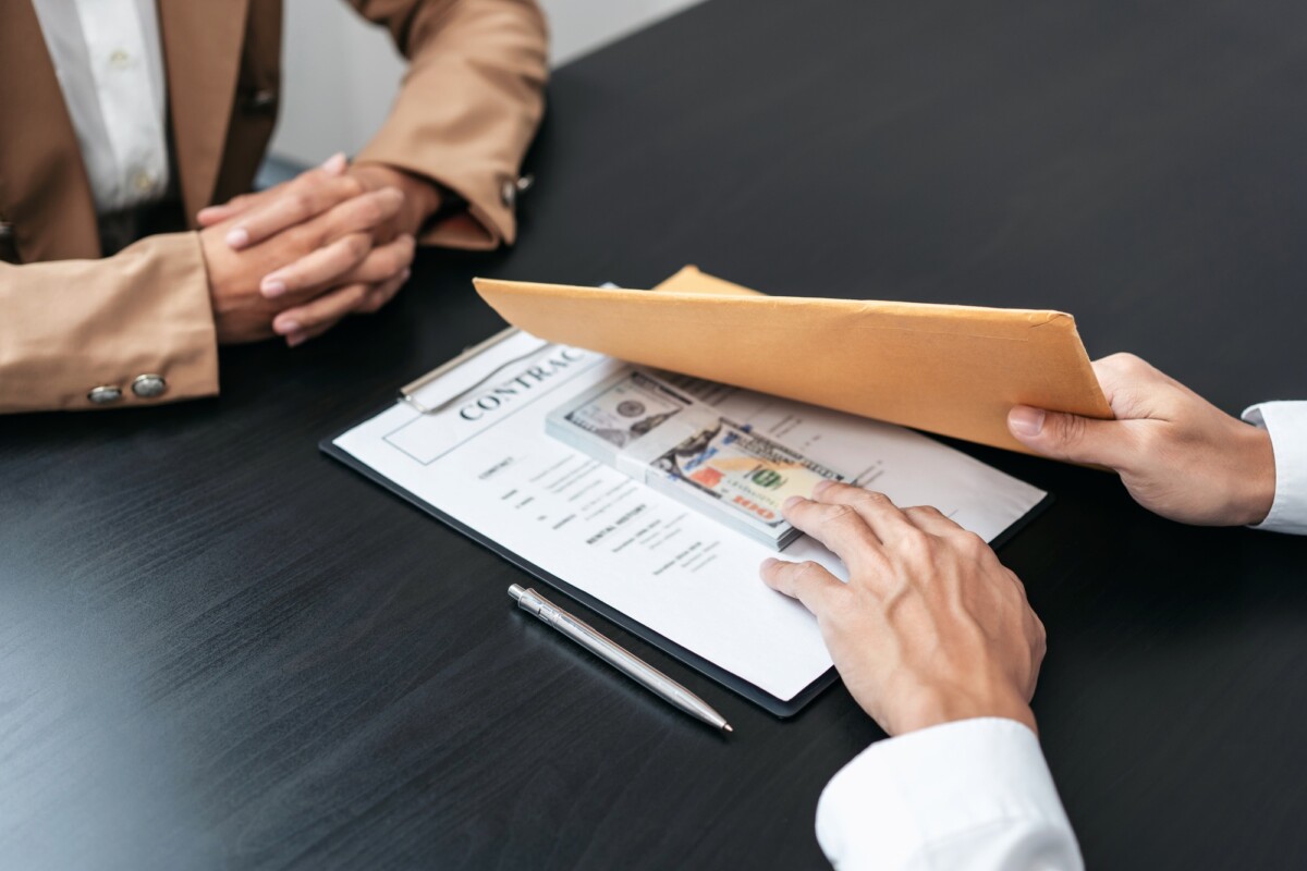 Bribe employer is offer terms to the businessman for signing on Bribe employer is offer terms to the businessman for signing on