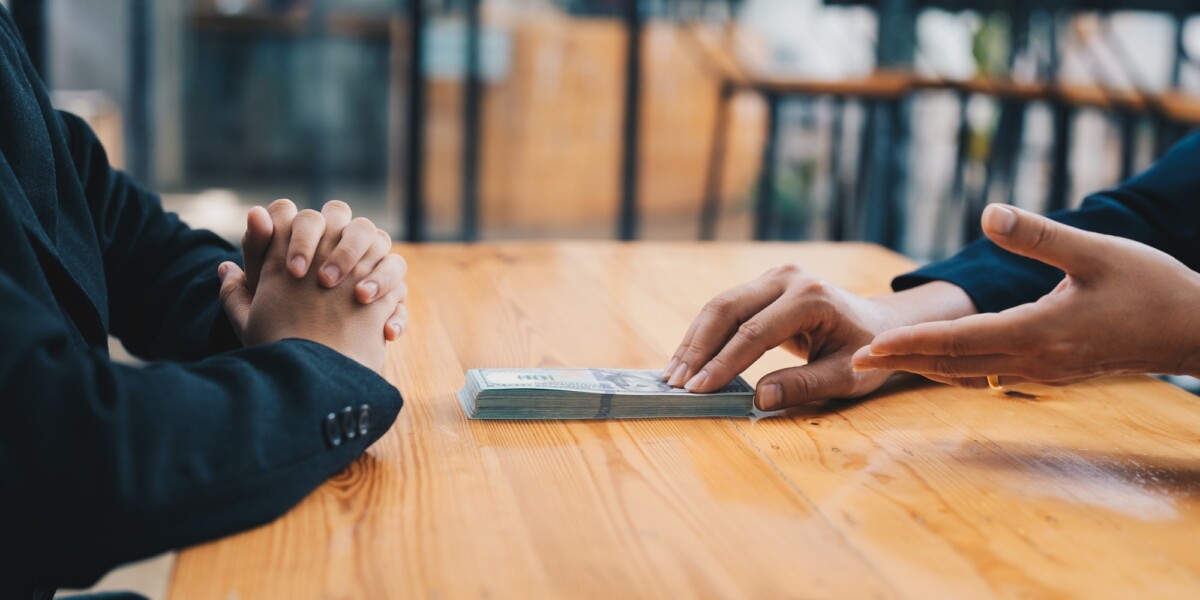 Hands banker giving cash money to businessman, loan and credit financial lease concept Hands banker giving cash money to businessman, loan and credit financial lease concept