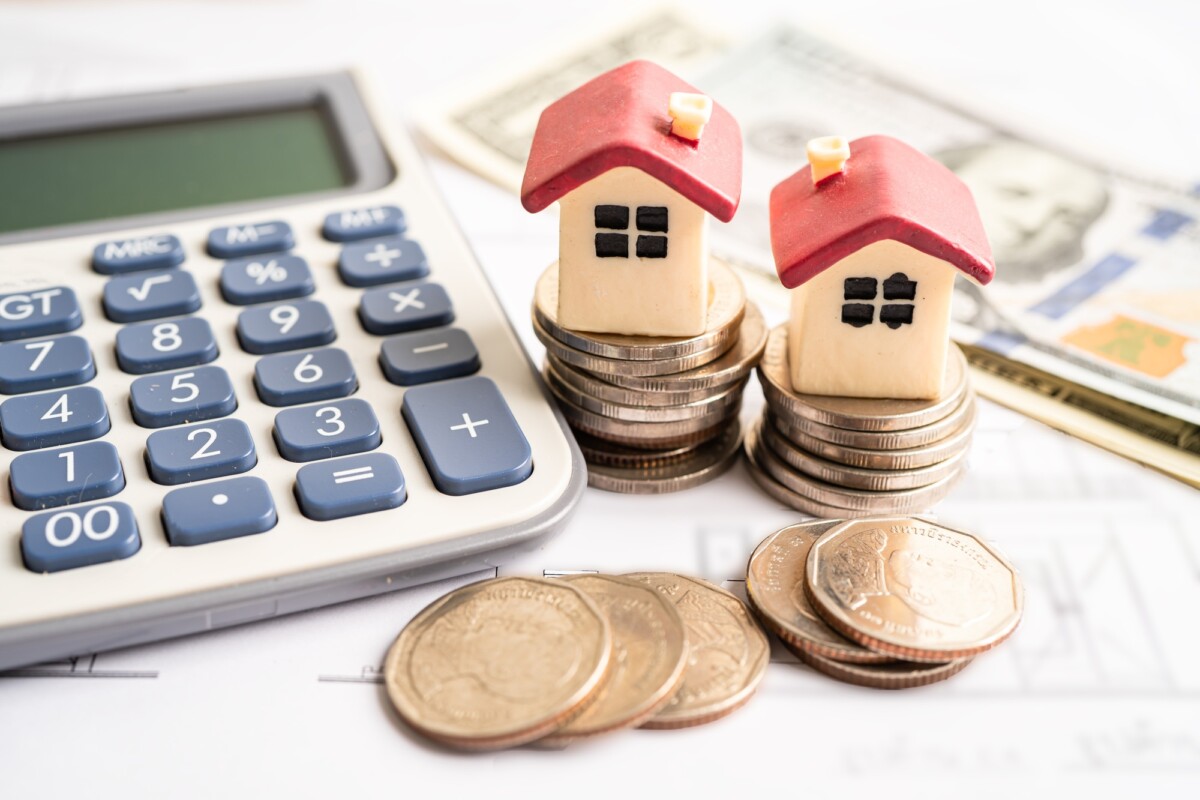 House model with stack of coin money, home loan, saving plan, installment payment.
