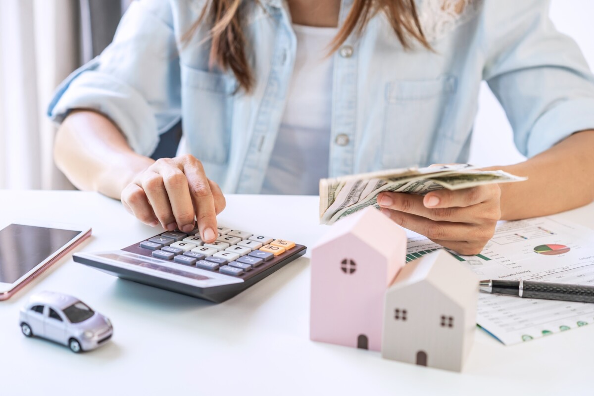 Stressed young woman calculating monthly home expenses and Car installment